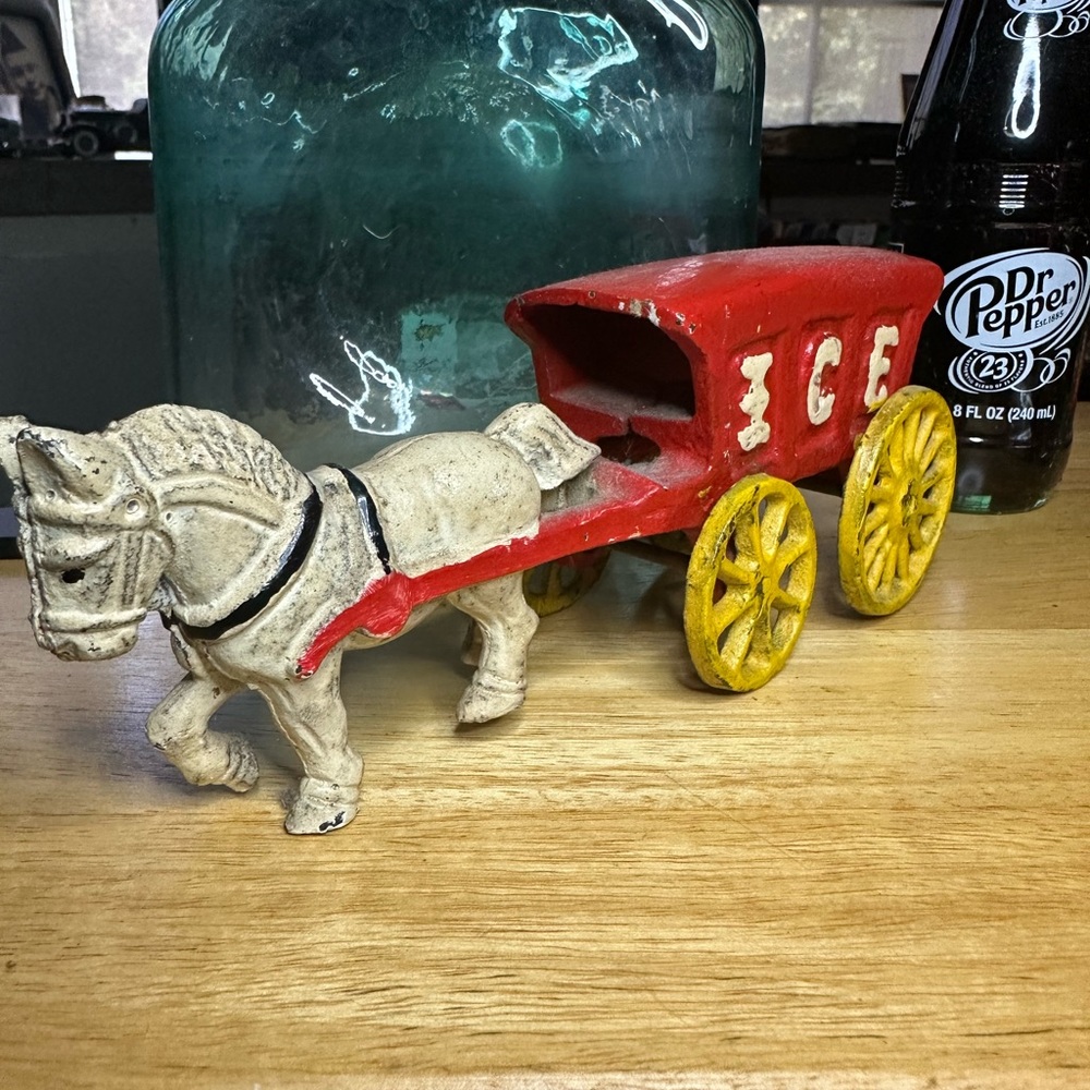 Vintage cast iron ice trailer and horse.